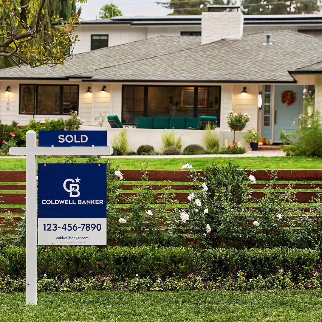 image of one story home with a SOLD coldwell banker sign out front